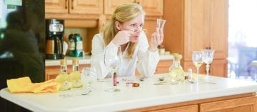 woman examining omega-3 products