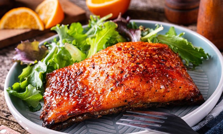 salmon and salad on a plate