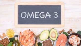 omega 3 on a chalkboard with foods high in essential fatty acids