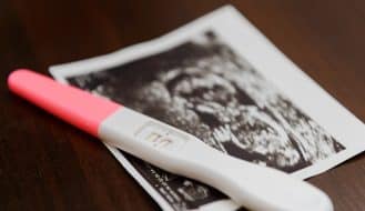 a pregnancy test and ultrasound photo