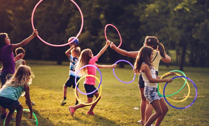 children playing with hula hoops