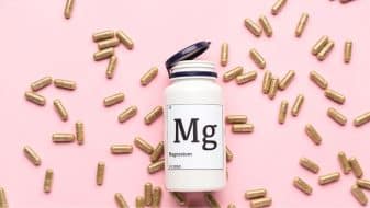 a bottle of magnesium and magnesium pills