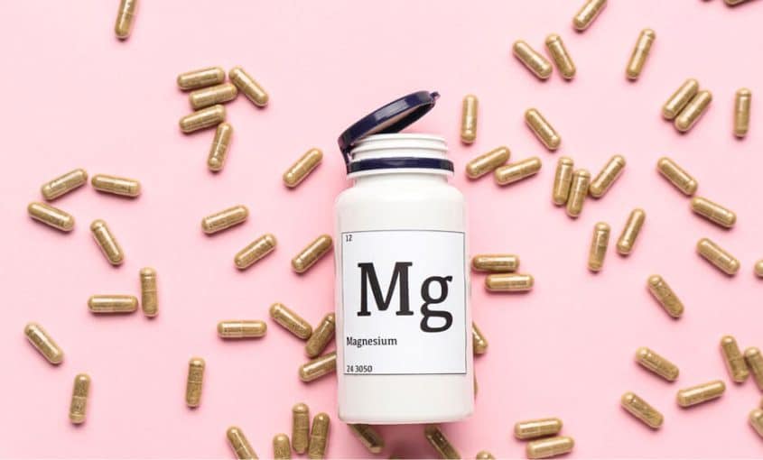 a bottle of magnesium and magnesium pills