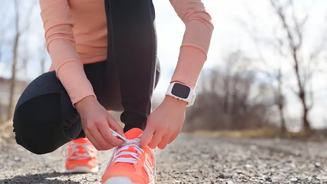 tying running shoes